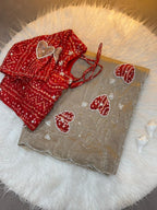 Royal Heart Motif Bandhani Saree with Rich Floral Pallu & Cutdana Embellishments