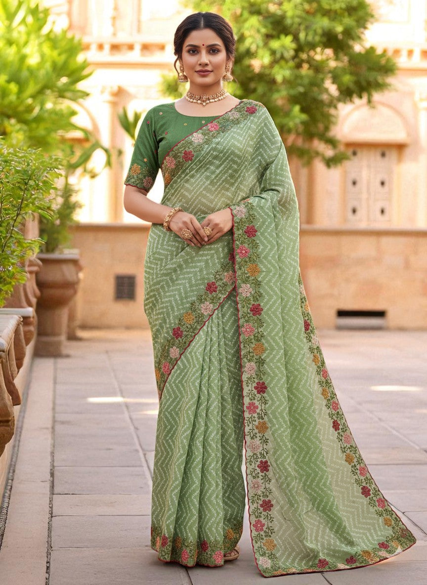Woman wearing a saree with floral patterns green