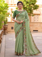 Woman wearing a saree with floral patterns green