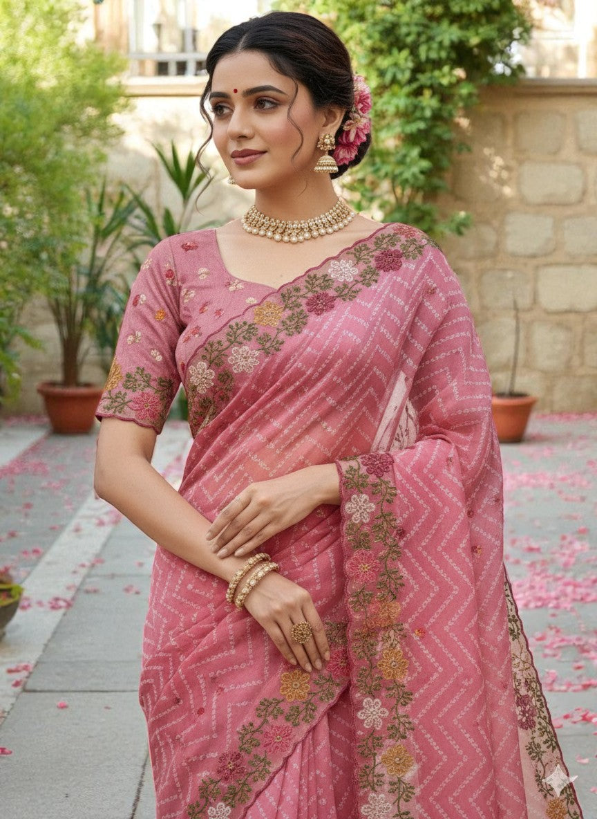 Woman wearing a saree with floral patterns pink