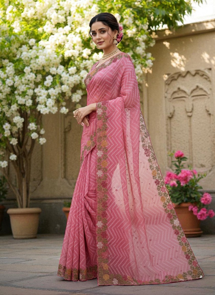 Woman wearing a saree with floral patterns pink