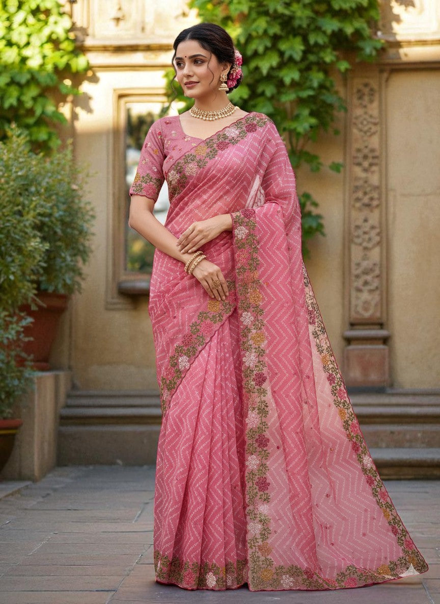 Woman wearing a saree with floral patterns pink