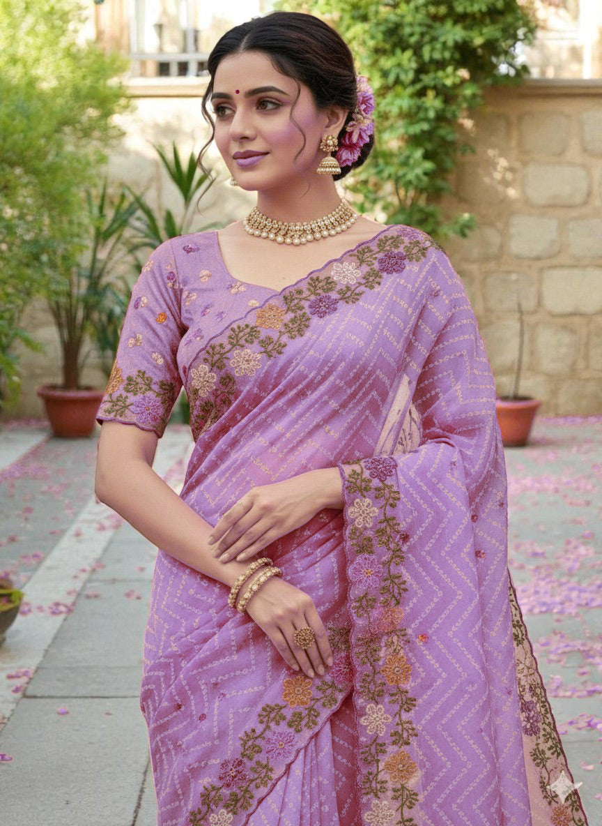Woman wearing a saree with floral patterns purple
