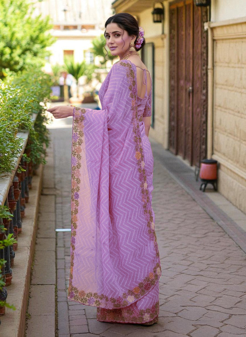 Woman wearing a saree with floral patterns purple