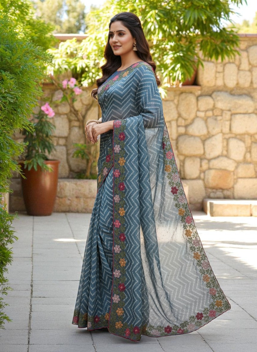 Woman wearing a saree with floral patterns rama

