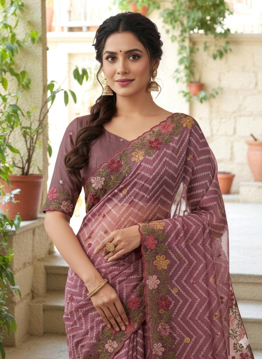 Woman wearing a saree with floral patterns wine