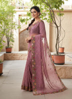 Woman wearing a saree with floral patterns wine