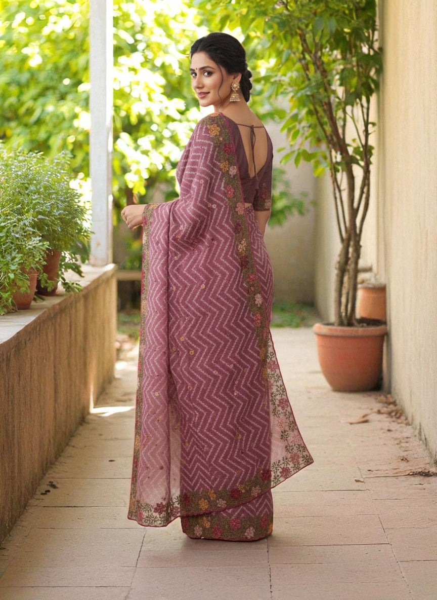 Woman wearing a saree with floral patterns wine
