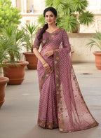 Woman wearing a saree with floral patterns wine