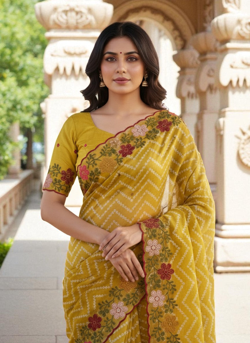 Woman wearing a yellow saree with floral patterns yellow