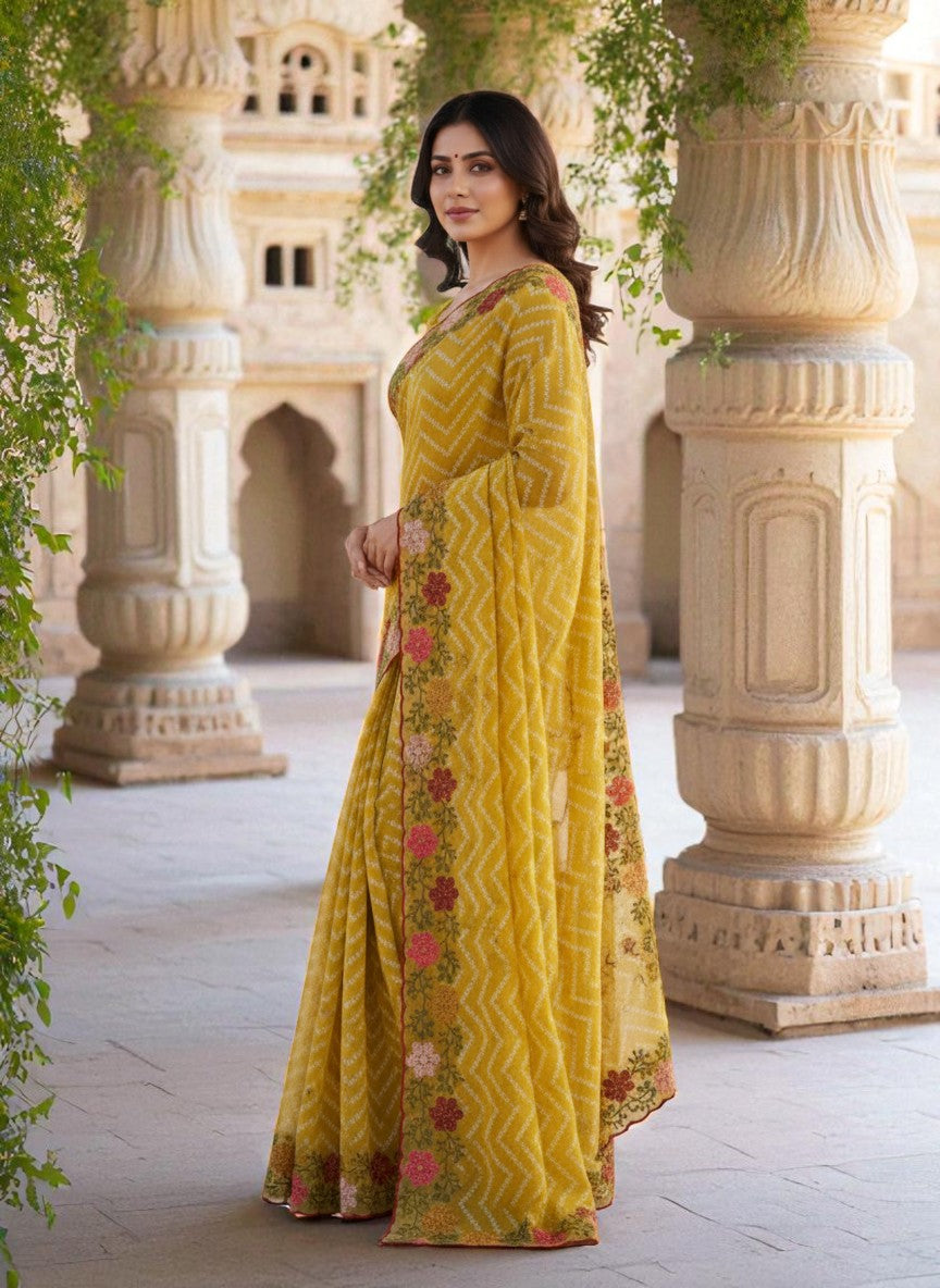 Woman wearing a yellow saree with floral patterns yellow